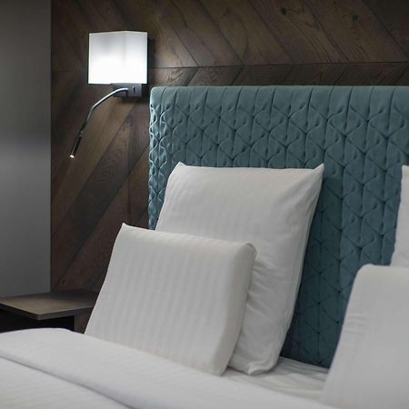 Pullman Riga Old Town Hotel Luaran gambar A bed with a headboard