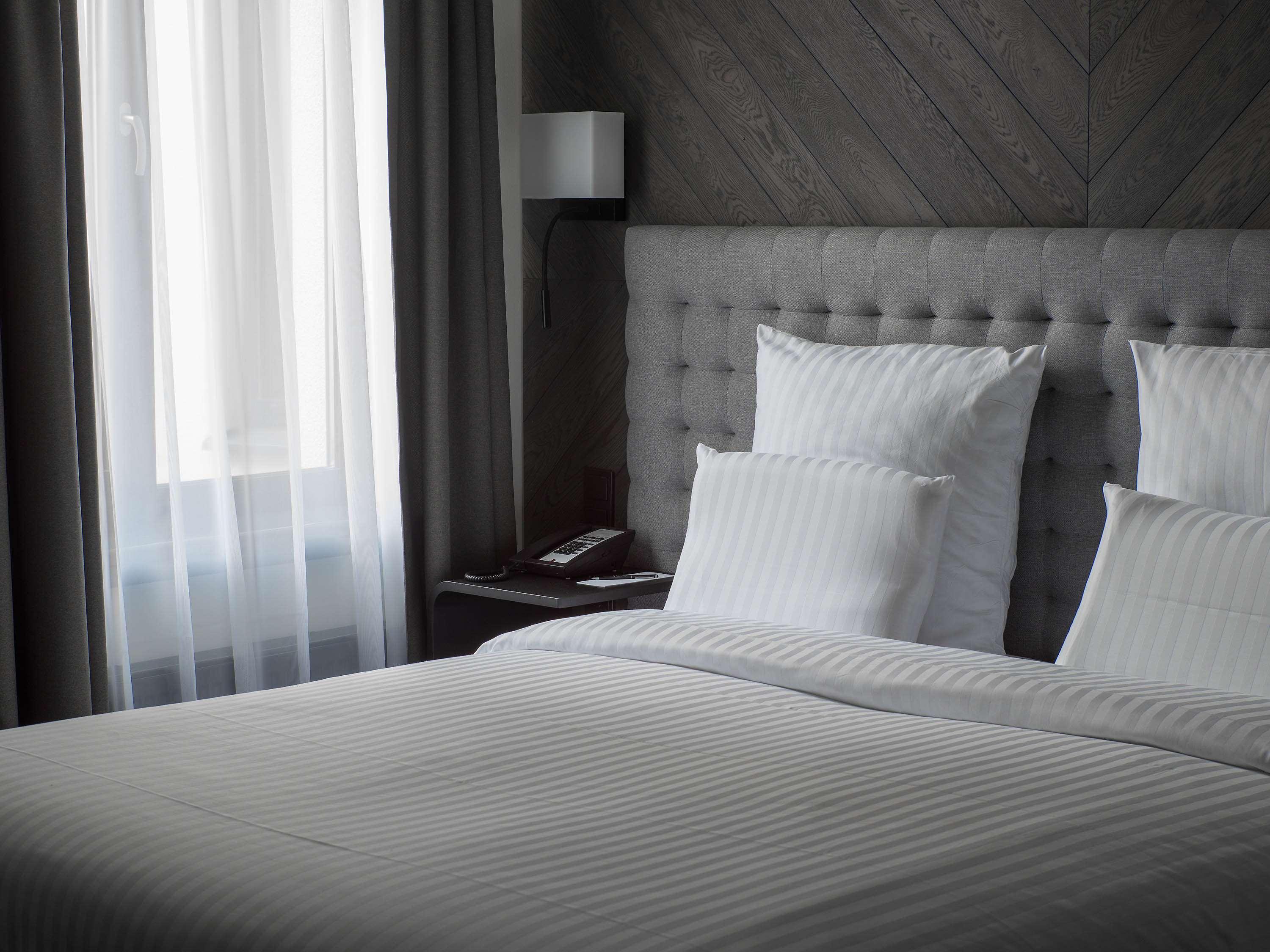 Pullman Riga Old Town Hotel Luaran gambar A bed with white sheets