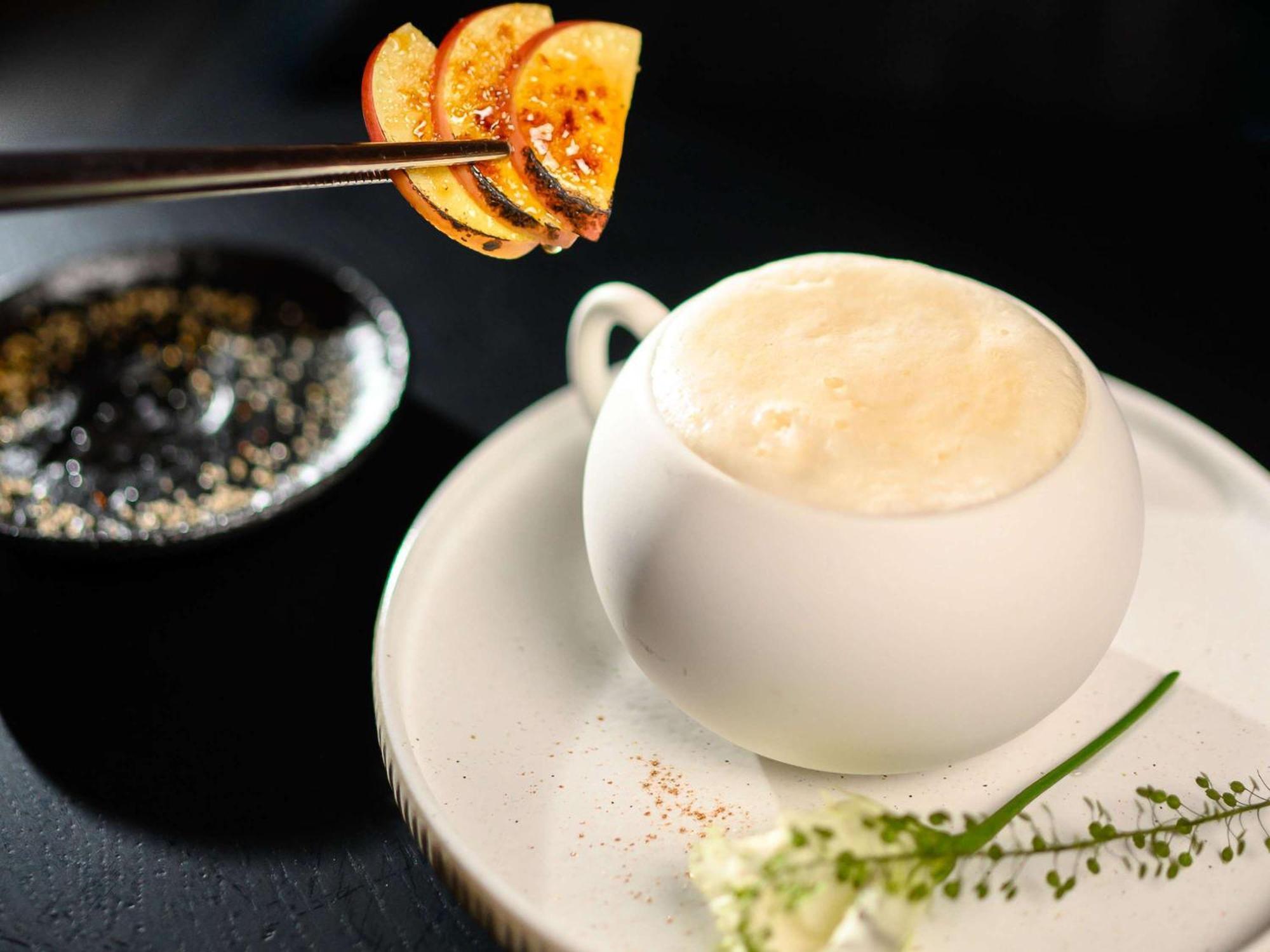 Pullman Riga Old Town Hotel Luaran gambar A cup of coffee with a slice of orange